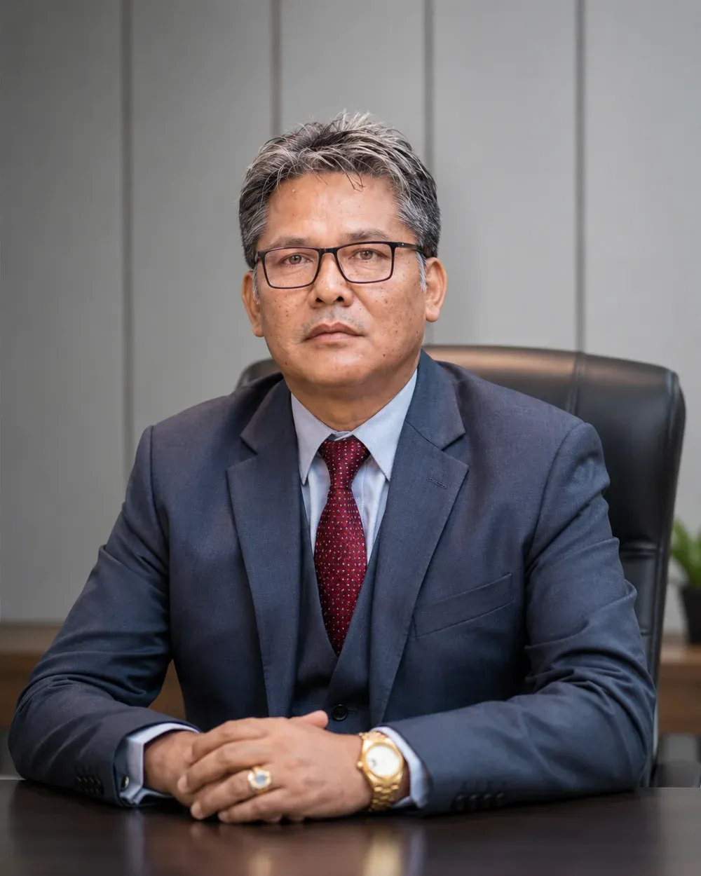 Purushotam Tuladhar, founder of Parimita Organization, at his desk